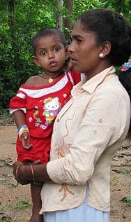 mother holding small child