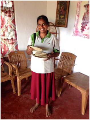 Malakumari holding some of her asmi sweets